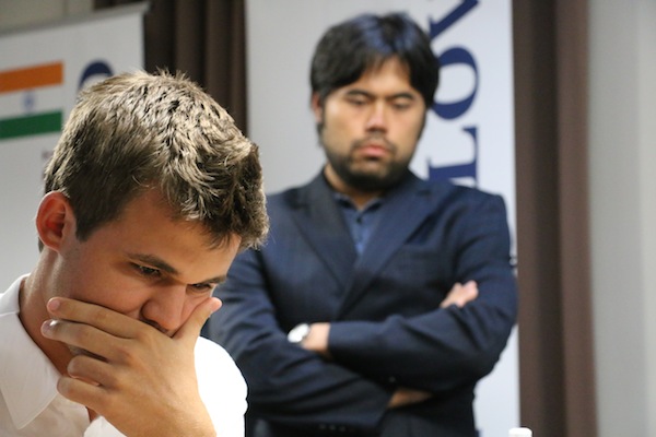 Nakamura peering at the Carlsen's game against MVL. Photo by chess.com.