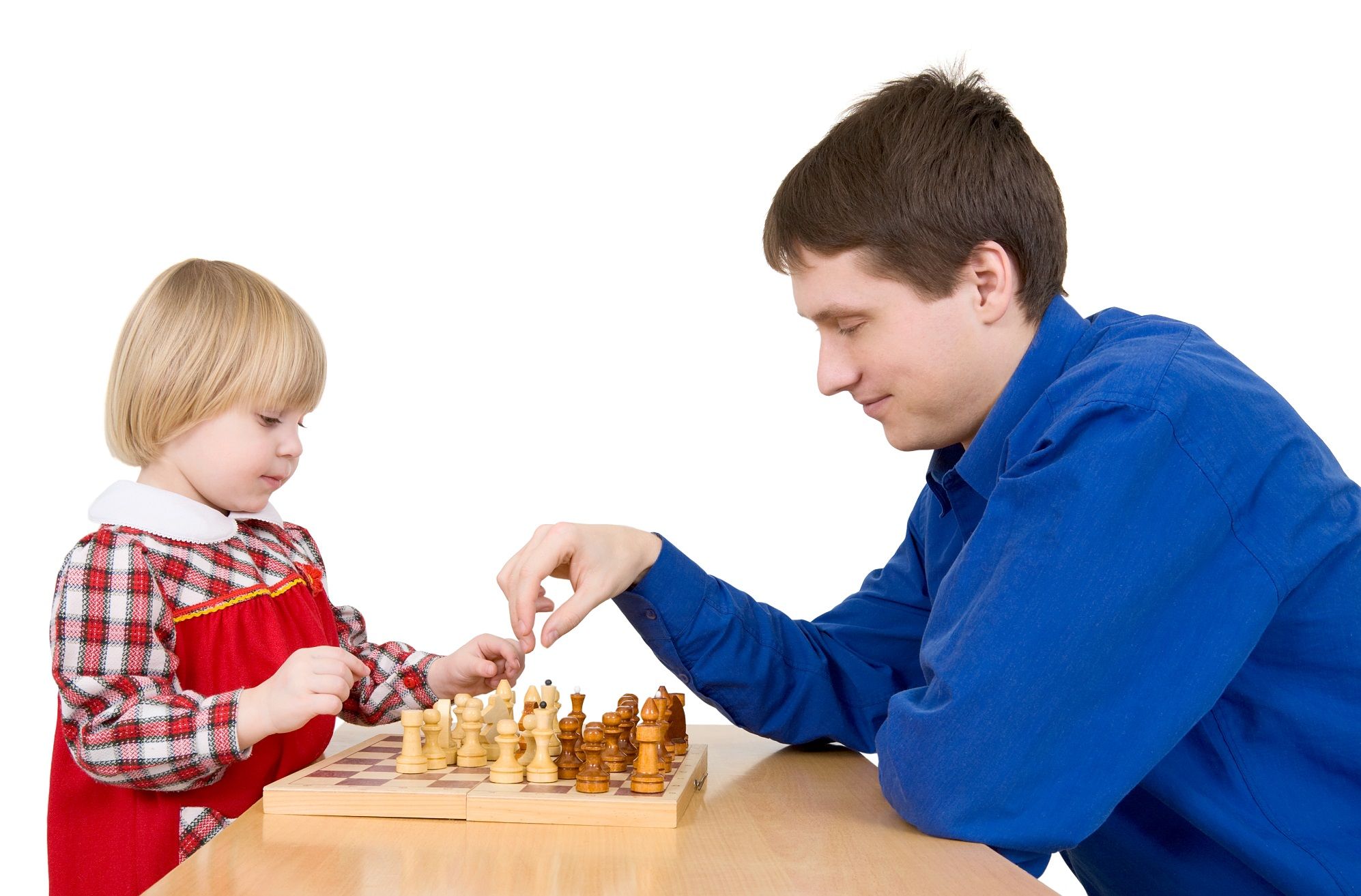 An adult man and young girl playing chess together.