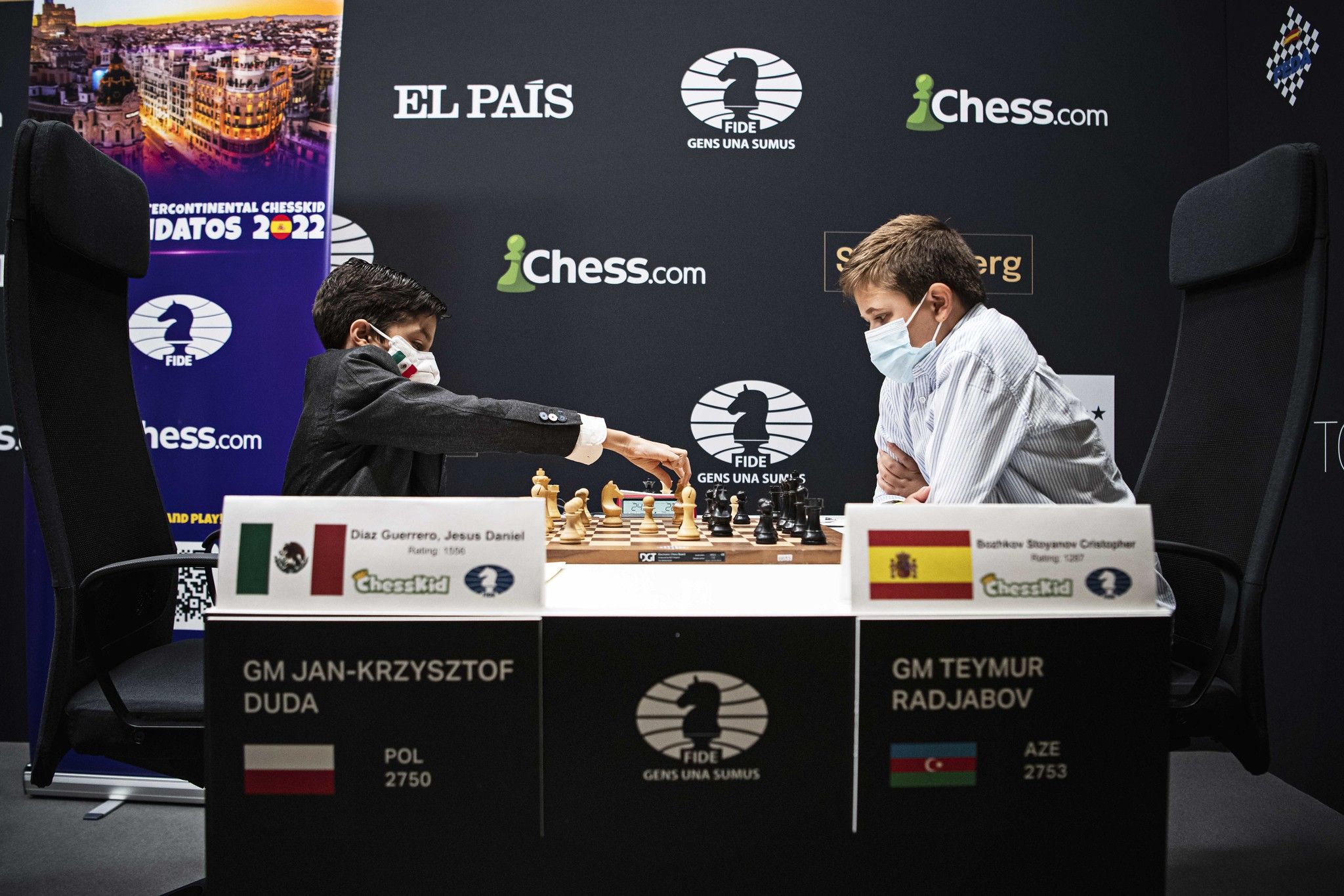 Two young chess players competing in the 2022 ChessKid Candidates Tournament in Madrid.