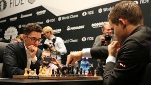 World Chess Championship Game 1: Caruana Struggles But Holds Draw Against Carlsen